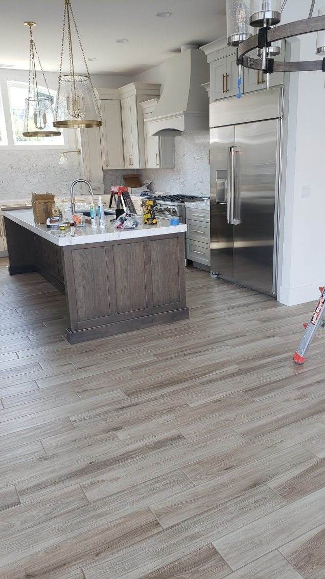 Wood-look tile kitchen floor with island in Wenatchee WA