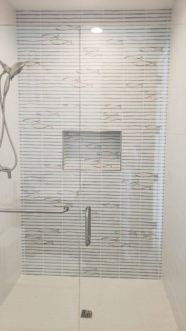 White mosaic tile shower with fish accent tile in Wenatchee WA