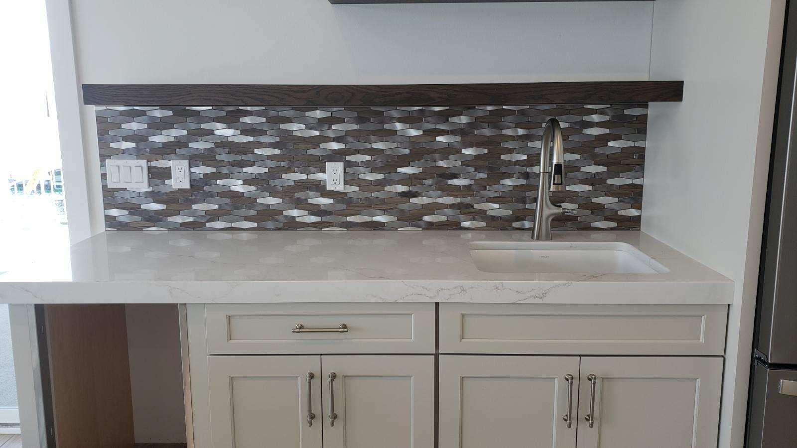 Metal mosaic tile wet bar backsplash with quartz countertop in Wenatchee WA